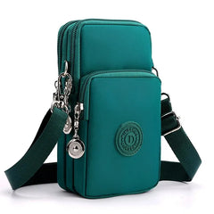 Green crossbody bag with a visible brand logo on a white background