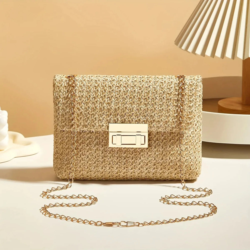 Woven handbag with a chain strap on a light surface with a neutral background