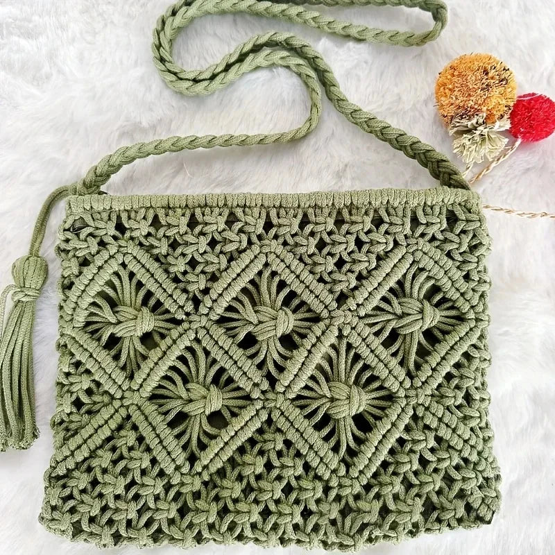 Green macrame handbag with a tassel on a white background