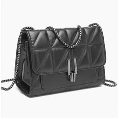 A black quilted faux-leather shoulder bag with a silver-tone chain strap and a double-bar clasp, shown on a plain white background.