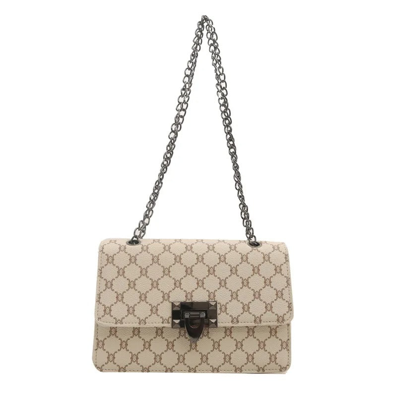 Beige handbag with a chain strap on a white background