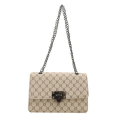 Beige handbag with a chain strap on a white background