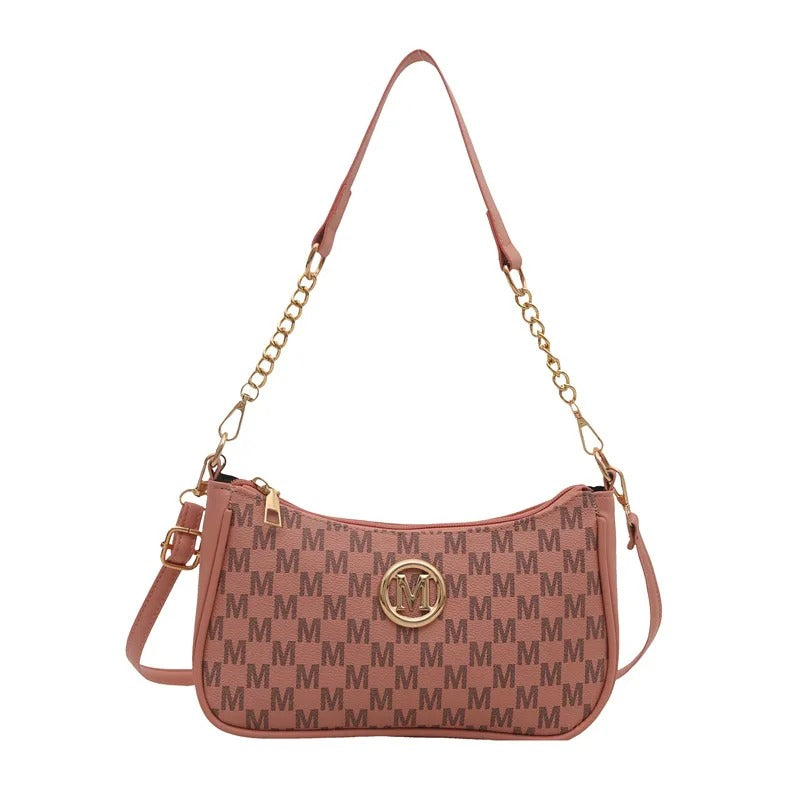 Brown handbag with gold chain strap and logo on a white background